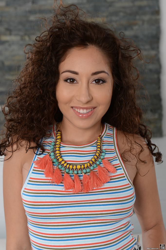 Curly-Haired Brunette Strips from Denim Shorts to Nude photo 3