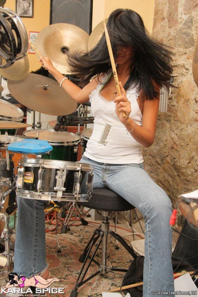 Karla Strips from Streetwear to Green Bikini beside a Drum Kit photo 5