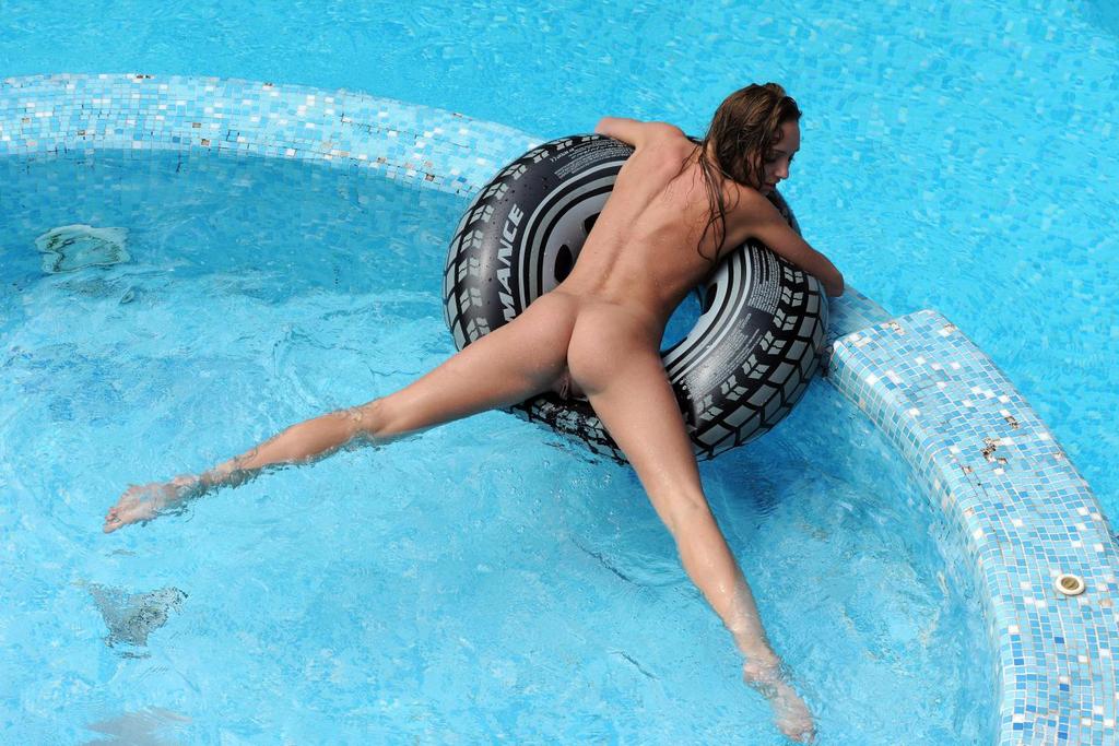 Tayra A presents her bare little breasts and sweet pussy in the pool 12