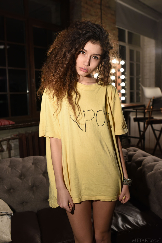 Brunette in an Oversized Yellow Shirt on a Rustic Loft Set photo 15