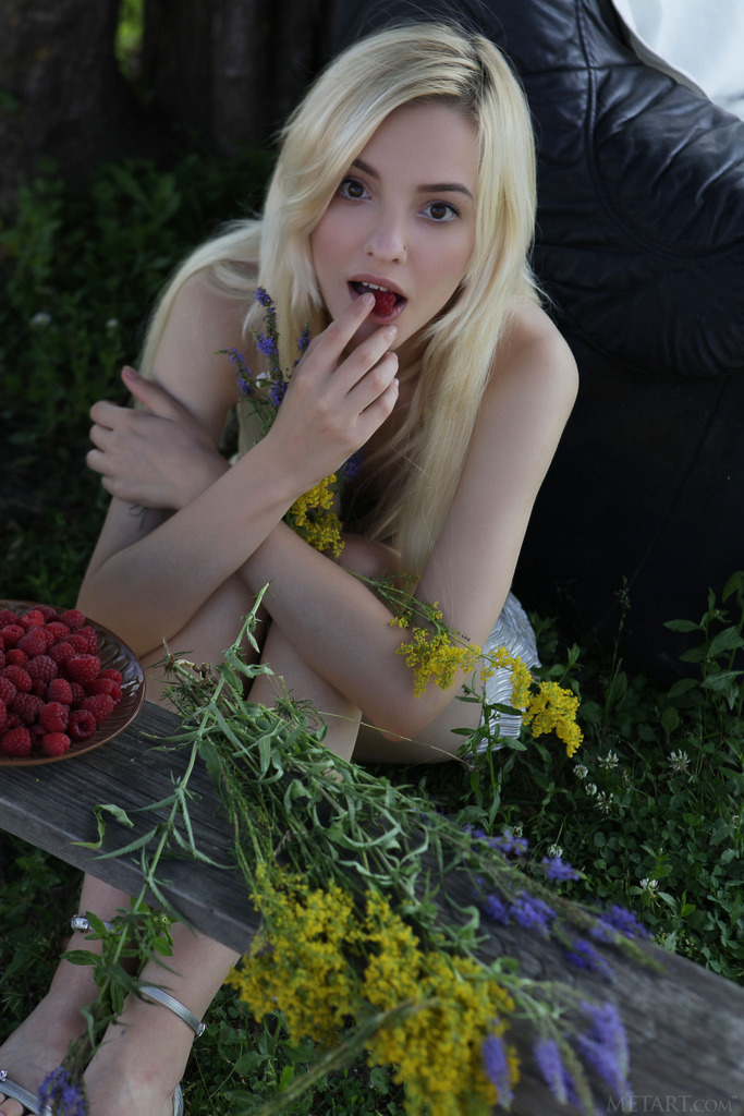  she devours a succulent raspberry between her luscious lips photo 3
