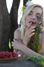  she devours a succulent raspberry between her luscious lips photo 4