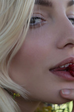  she devours a succulent raspberry between her luscious lips photo 6