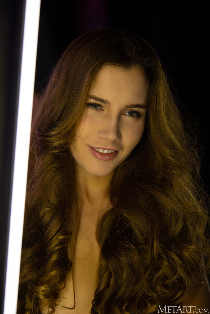 Neon-Lit Nude Posing in a Dark Studio photo 7