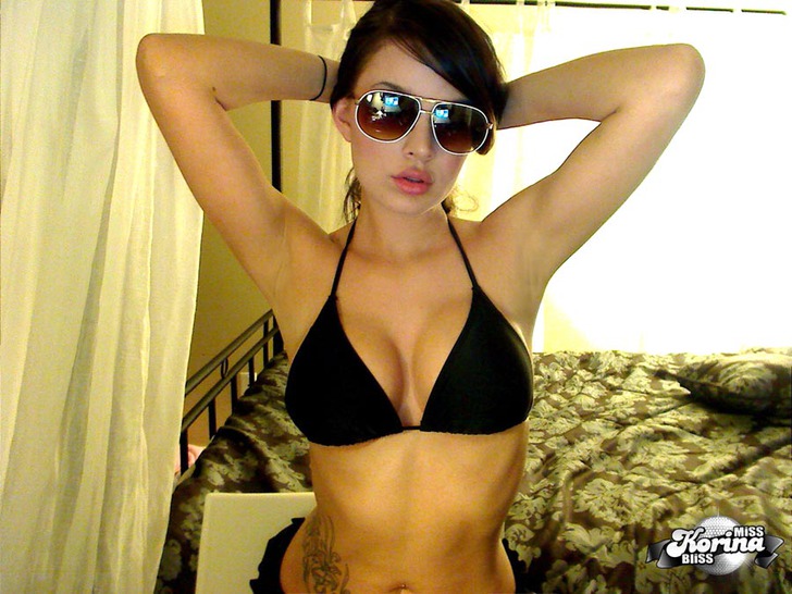 Korina Bliss shows off her Tits in a tiny black Bikini photo 4
