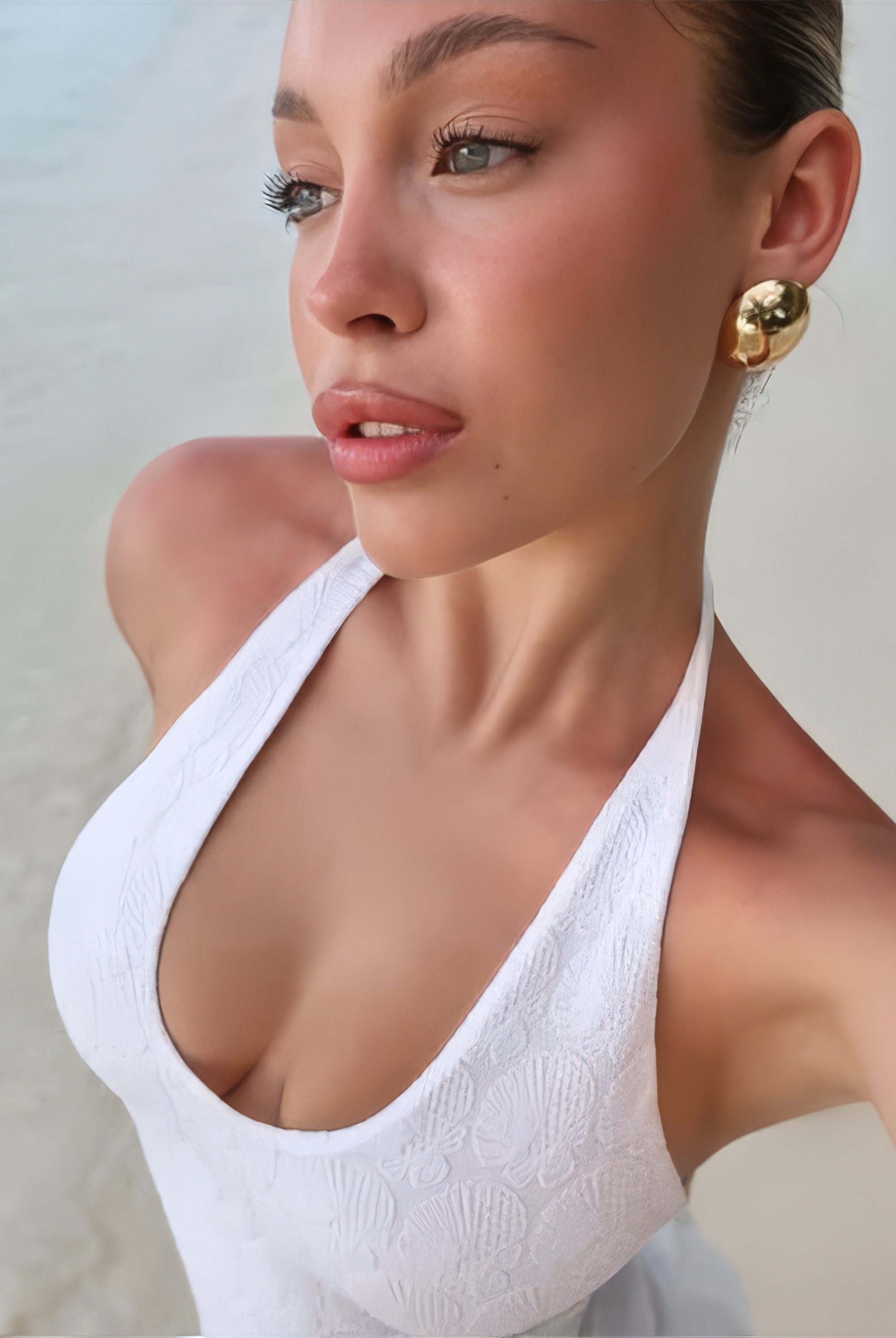 Gogol Marie in Dark Swimwear and a White Robe