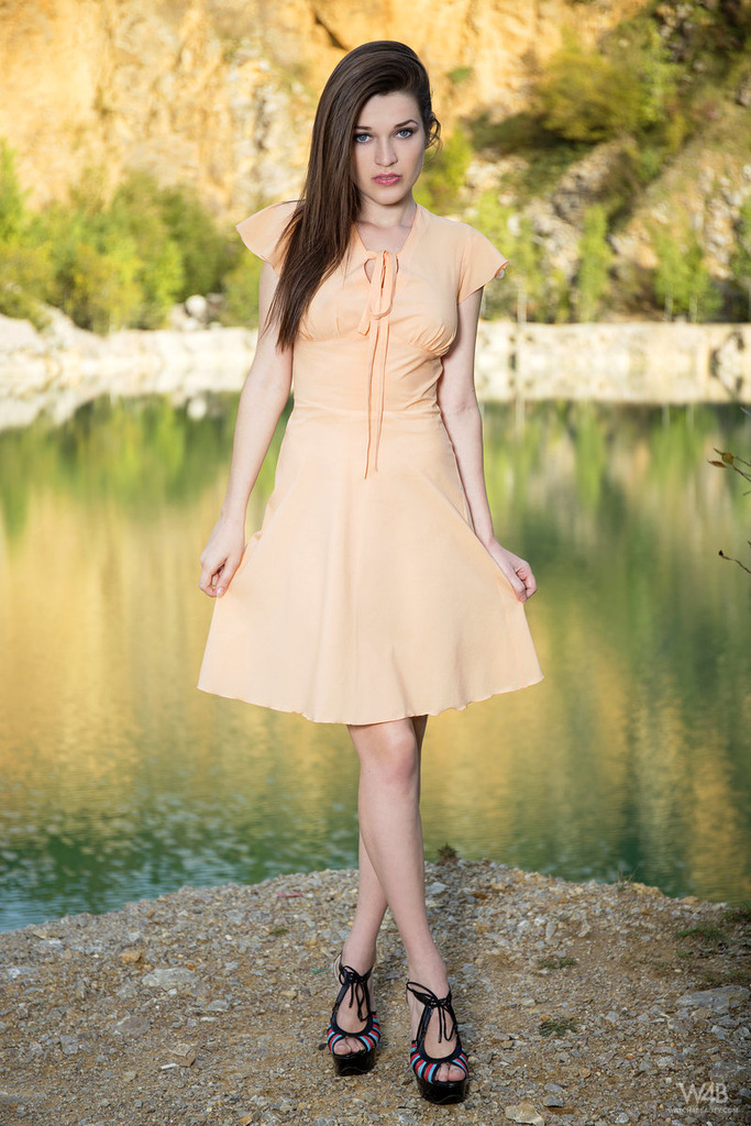 Serena posing outdoor in sexy dress 00