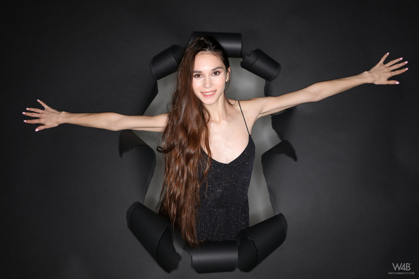 Black Cutout Dress on a Sculptural Chair in a Dark Studio photo 4