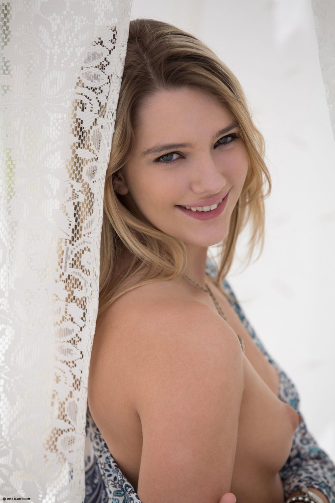 Naughty Kenna sensualy pleasures her pussy on the bed 02